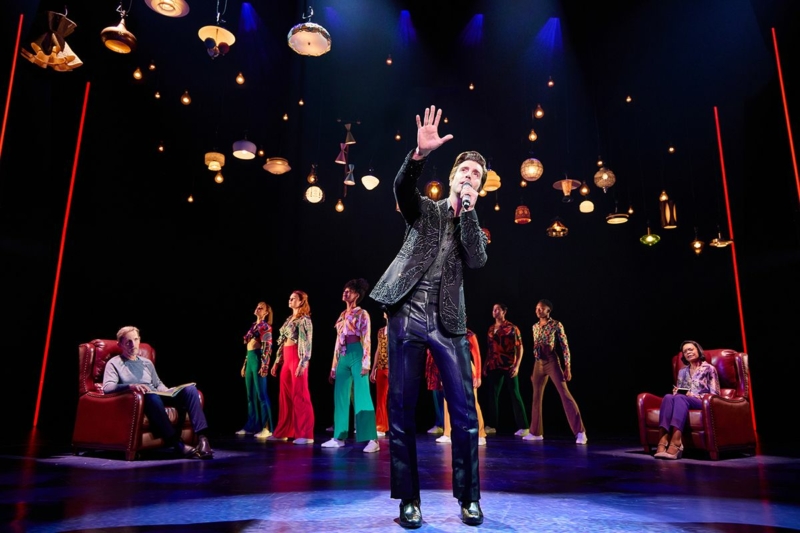 Nick Fradiani as 'Neil - Then' (center), Robert Westenberg as 'Neil - Now' (left), Lisa Reneé Pitts as 'Doctor' and 'The Noise' in A Beautiful Noise: The Neil Diamond Musical.